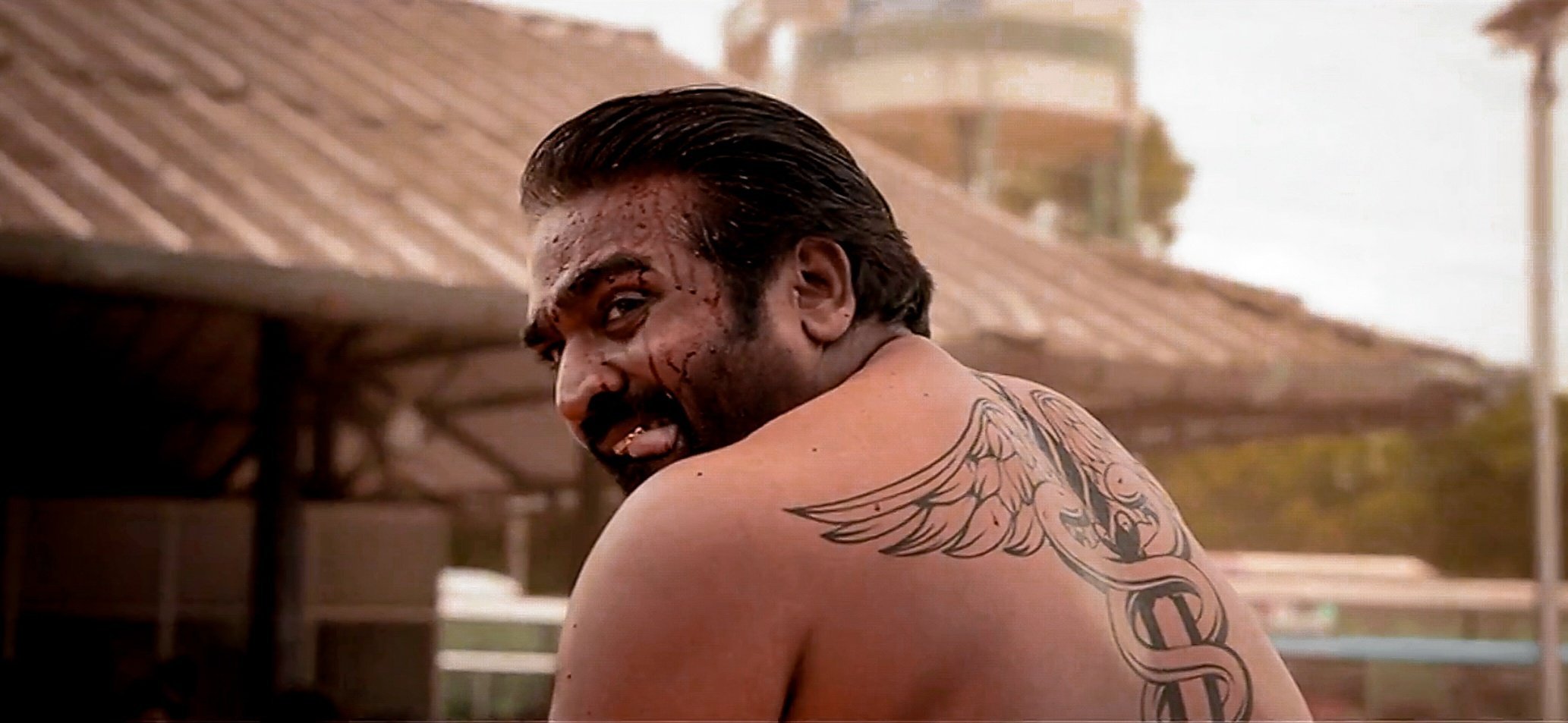 Suriya rolex neck tattoo behind the scenes photos one year of vikram movie  kamal haasan lokesh kanagaraj