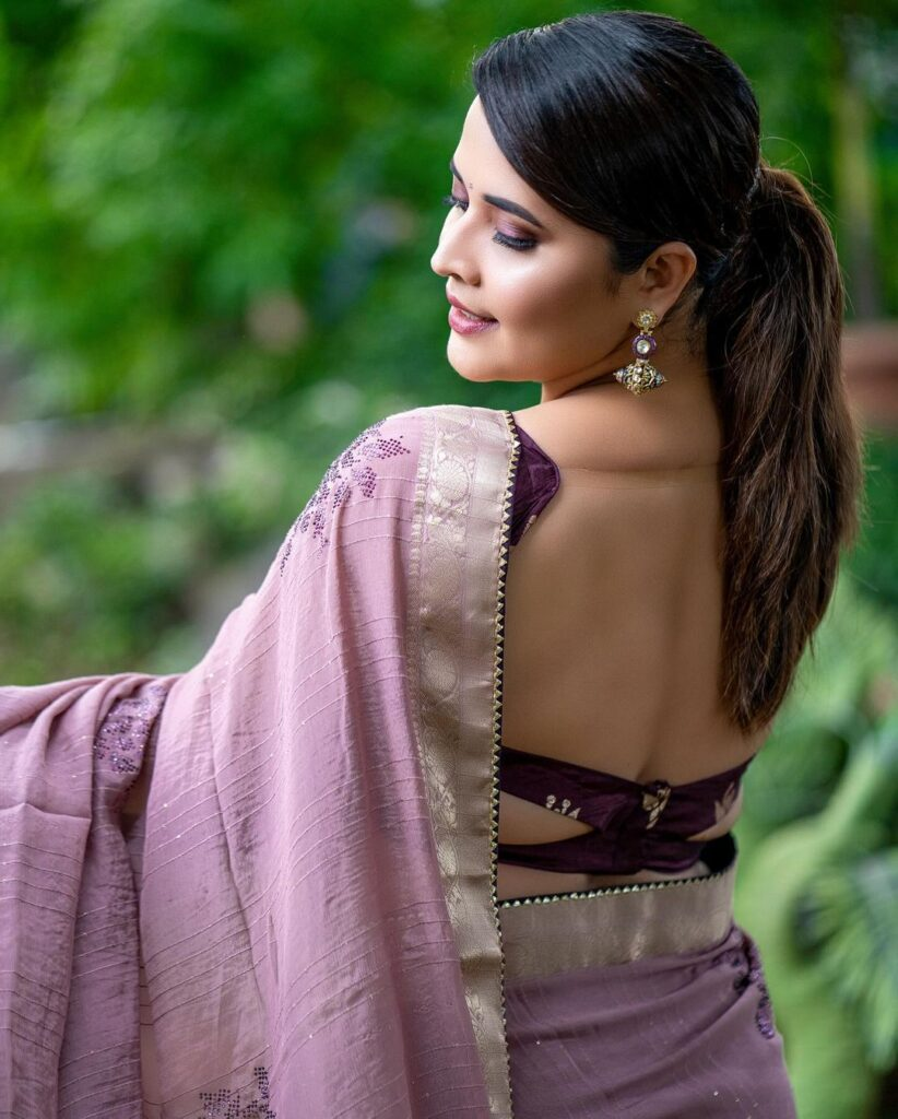 Divi Shines with Backless Saree Style