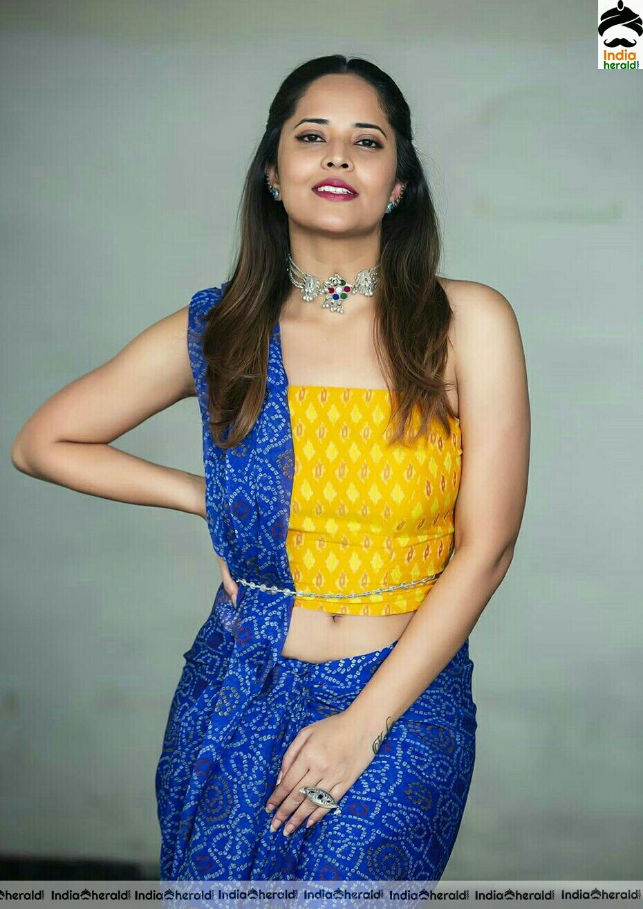 Anasuya Hot Navel Show In Blue Saree Stills