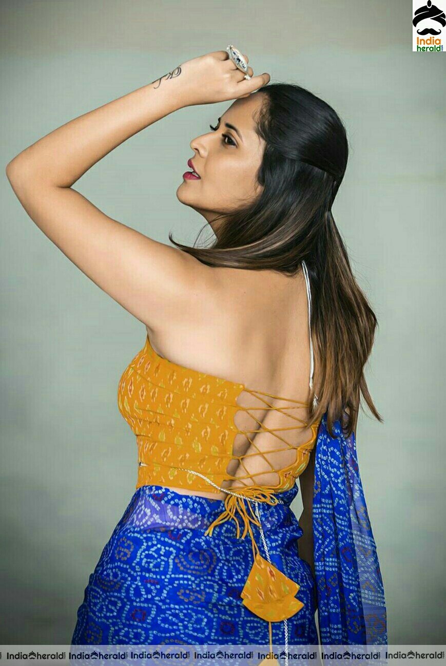 Anasuya Hot Navel Show In Blue Saree Stills