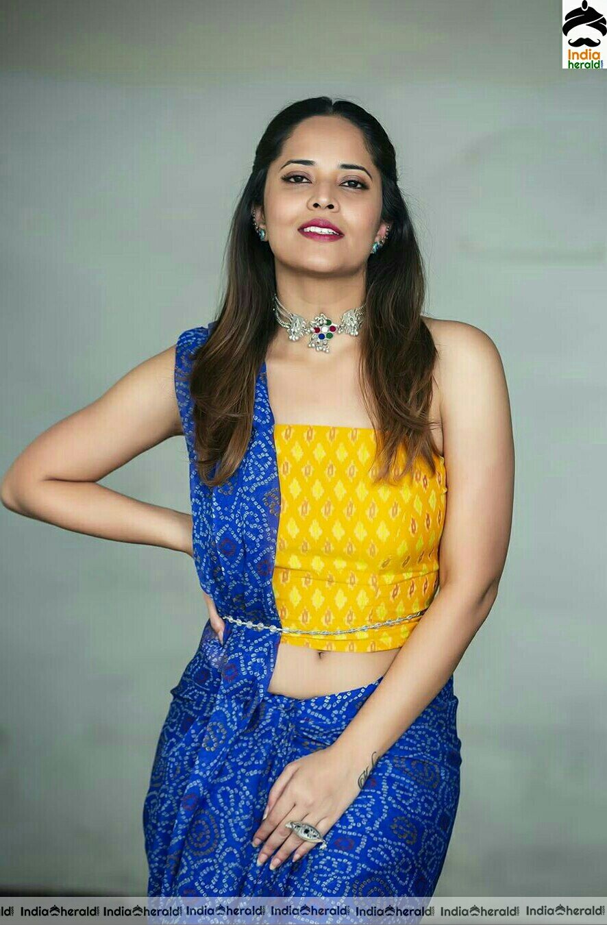 Anasuya Hot Navel Show In Blue Saree Stills