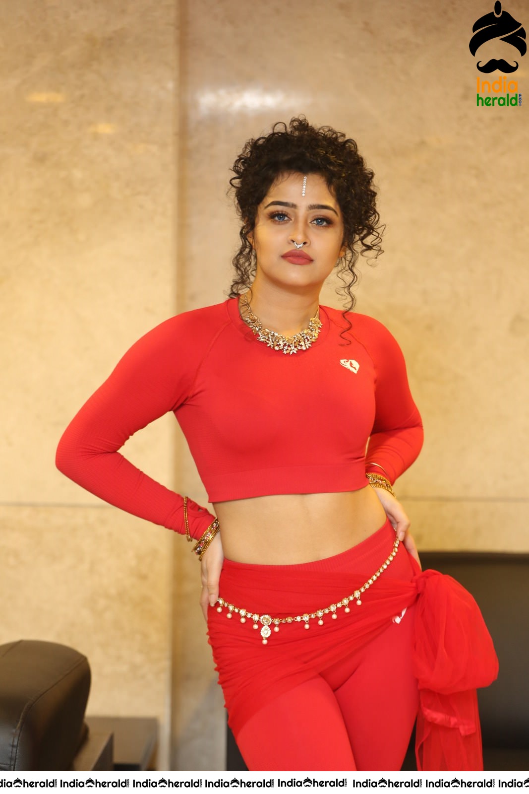 Ankeeta Shows her Teasing Waistline in Red Costume Set 1