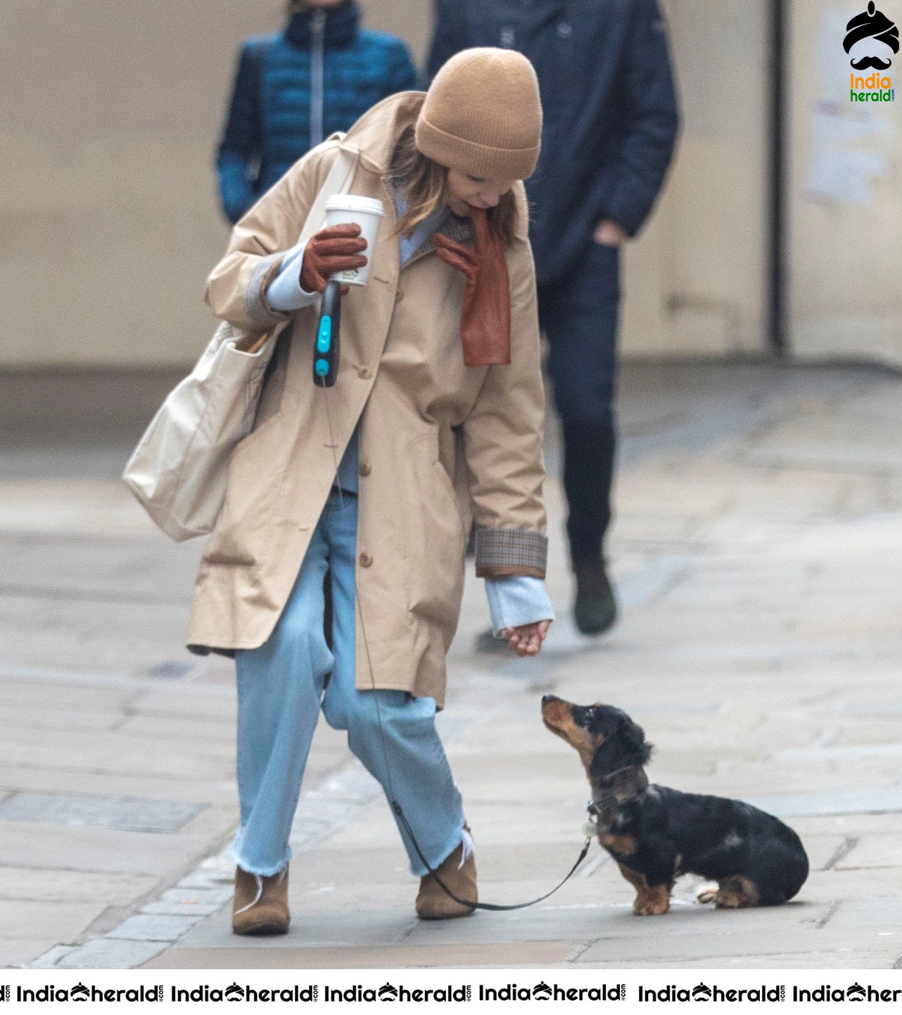 Emilia Clarke Takes her dog for a stroll as she steps out for a coffee in London