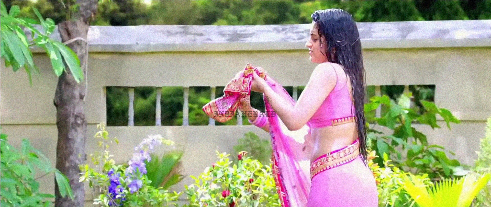 Hottest Photos of Trisha Getting Wet and Stripping Her Saree Set 2