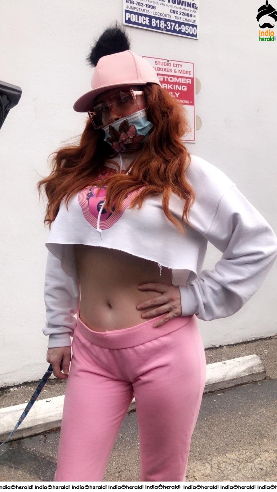 Phoebe Price shows her midriff and wears a mask due to Corona in West Hollywood