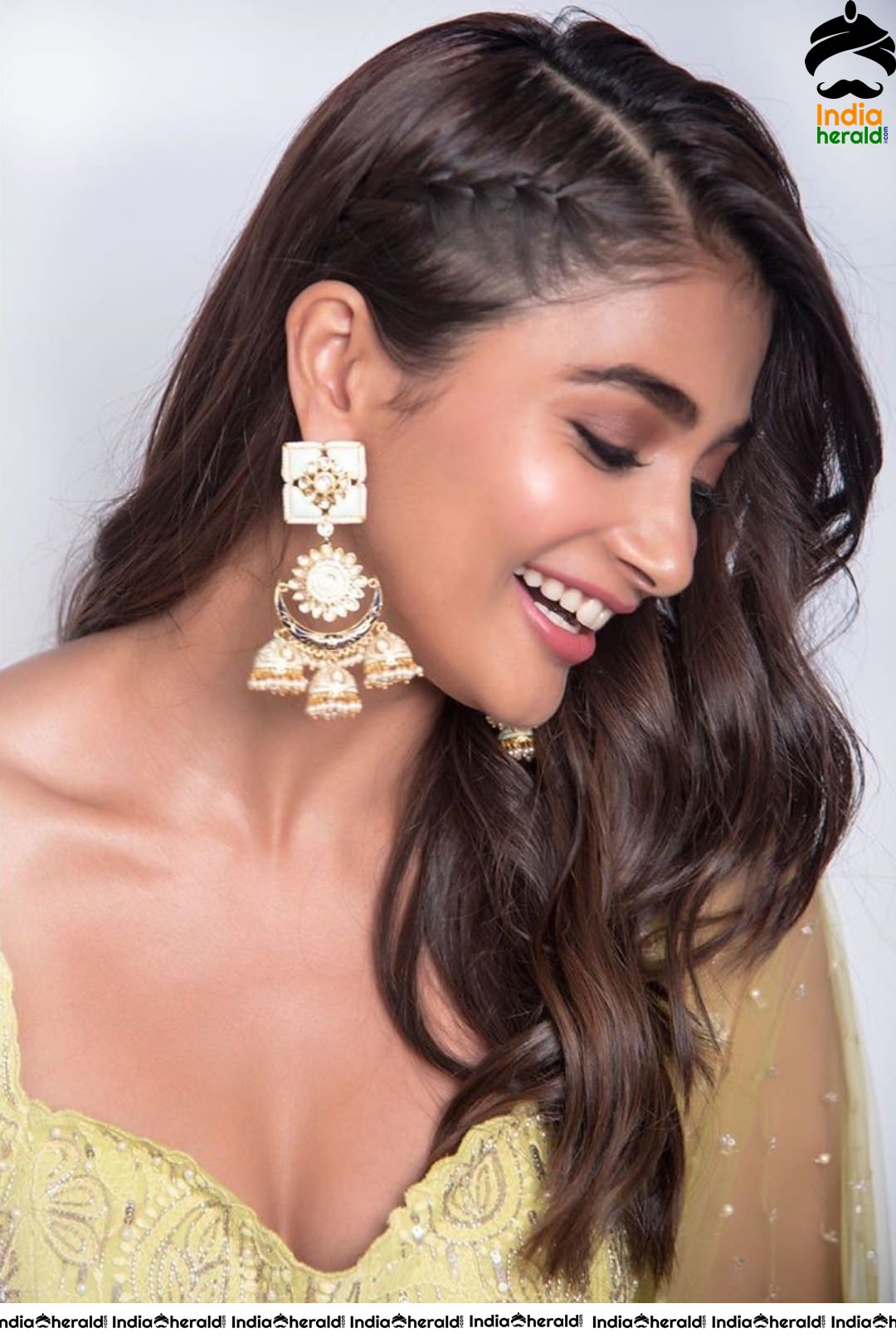 Pooja Hegde Flaunts her Sexy Waist and Cleavage in Yellow Blouse and Skirt