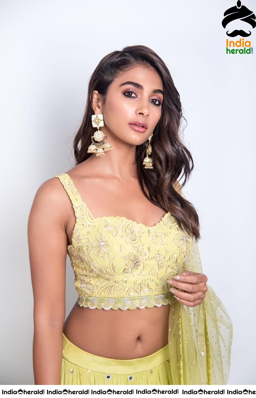 Pooja Hegde Flaunts her Sexy Waist and Cleavage in Yellow Blouse and Skirt