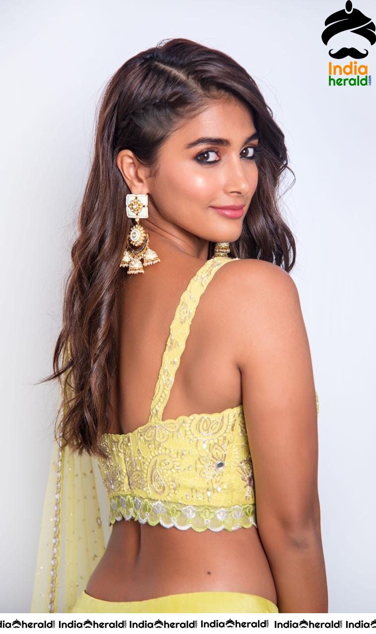 Pooja Hegde Flaunts her Sexy Waist and Cleavage in Yellow Blouse and Skirt