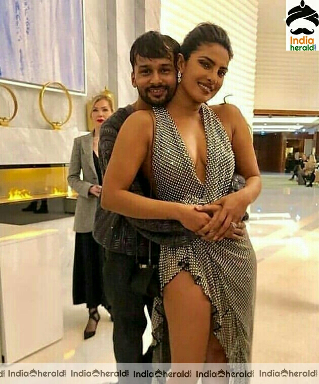 Priyanka Chopra gets hugged from behind as she exposes her hot deep cleavage