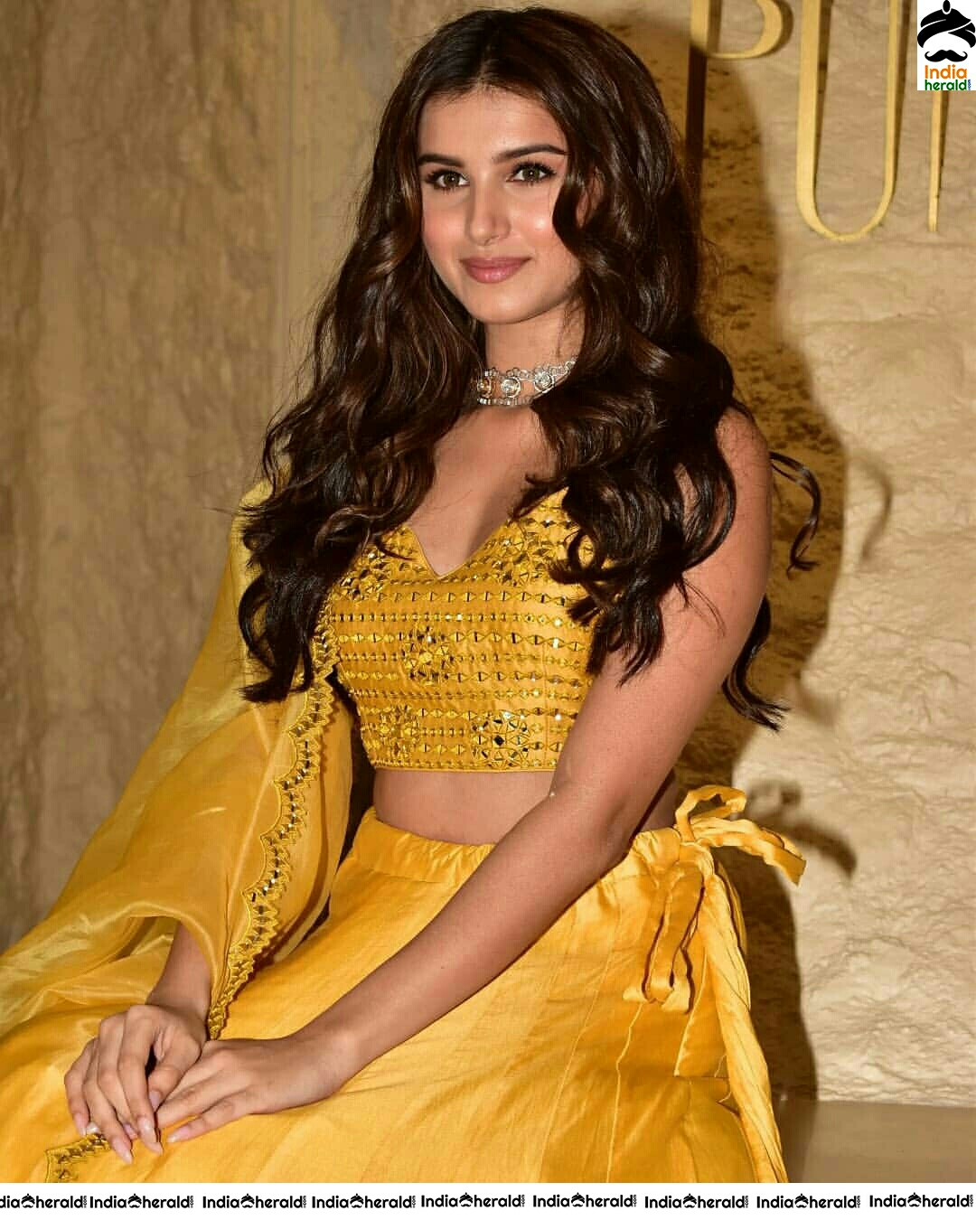 Tara Sutaria Sizzling In Yellow Waistline Revealing Dress