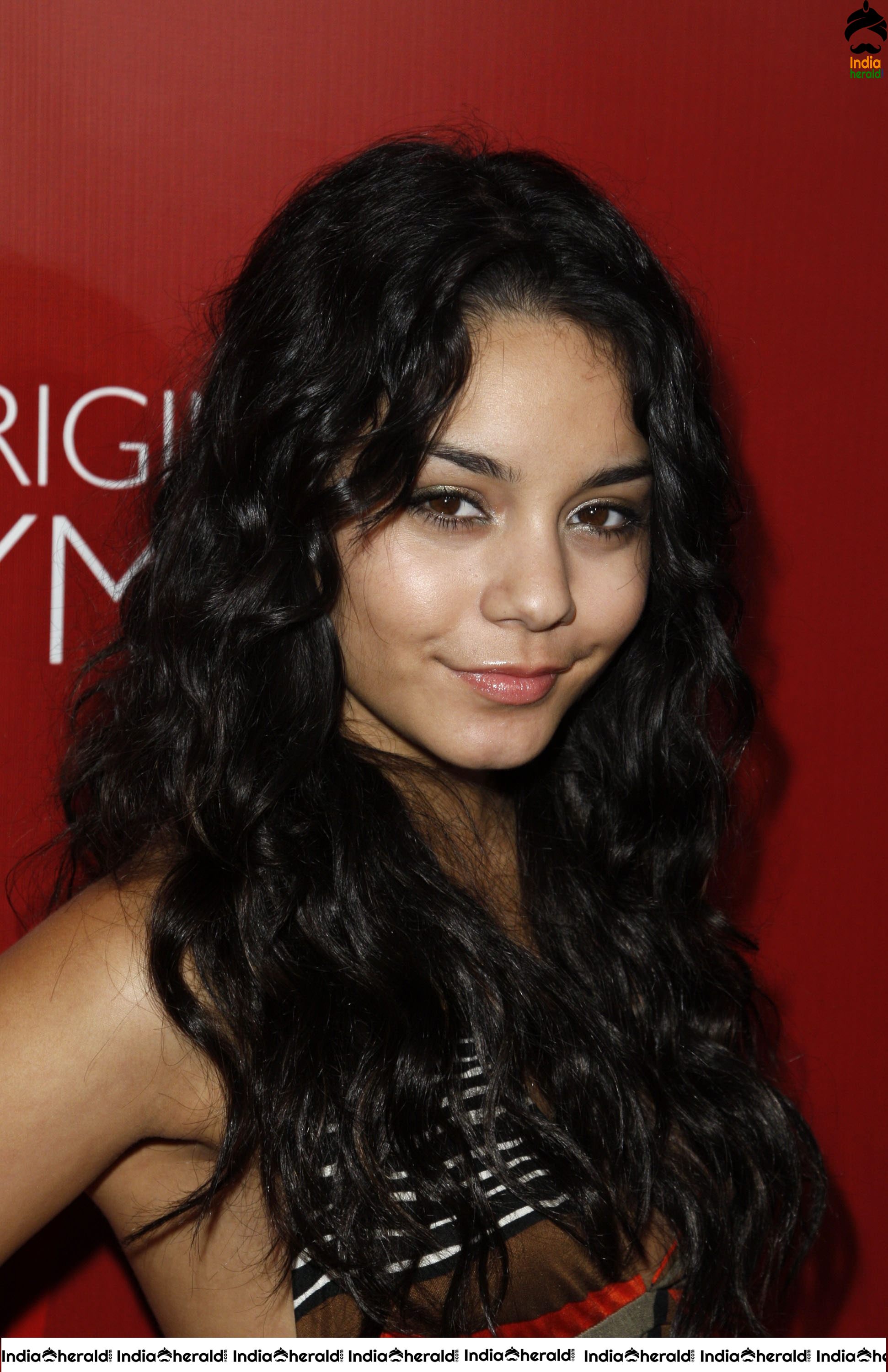 Vanessa Hudgens Flaunts her Smile and her Sexy Back at Fredricks of Hollywood Fashion Show