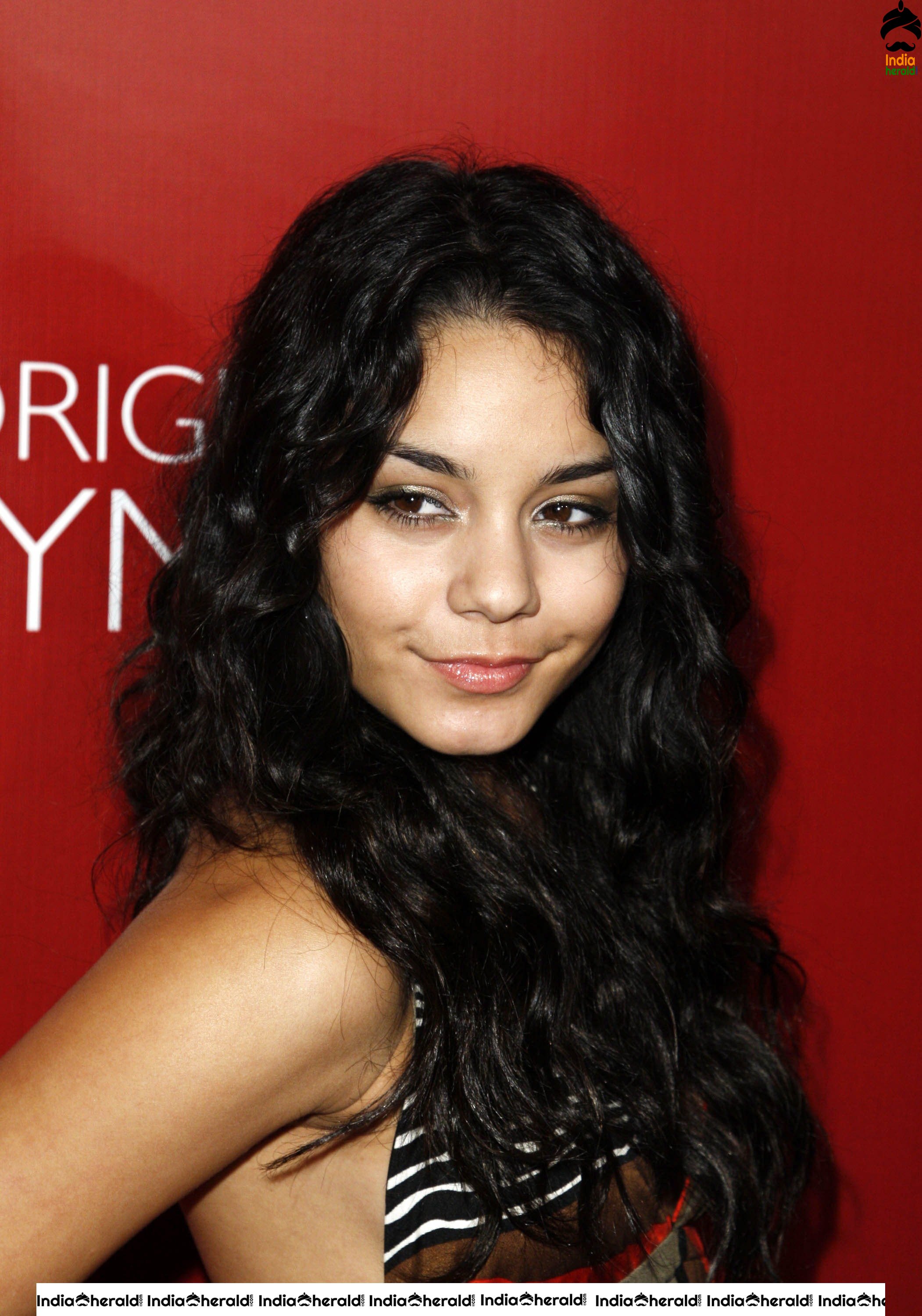 Vanessa Hudgens Flaunts her Smile and her Sexy Back at Fredricks of Hollywood Fashion Show