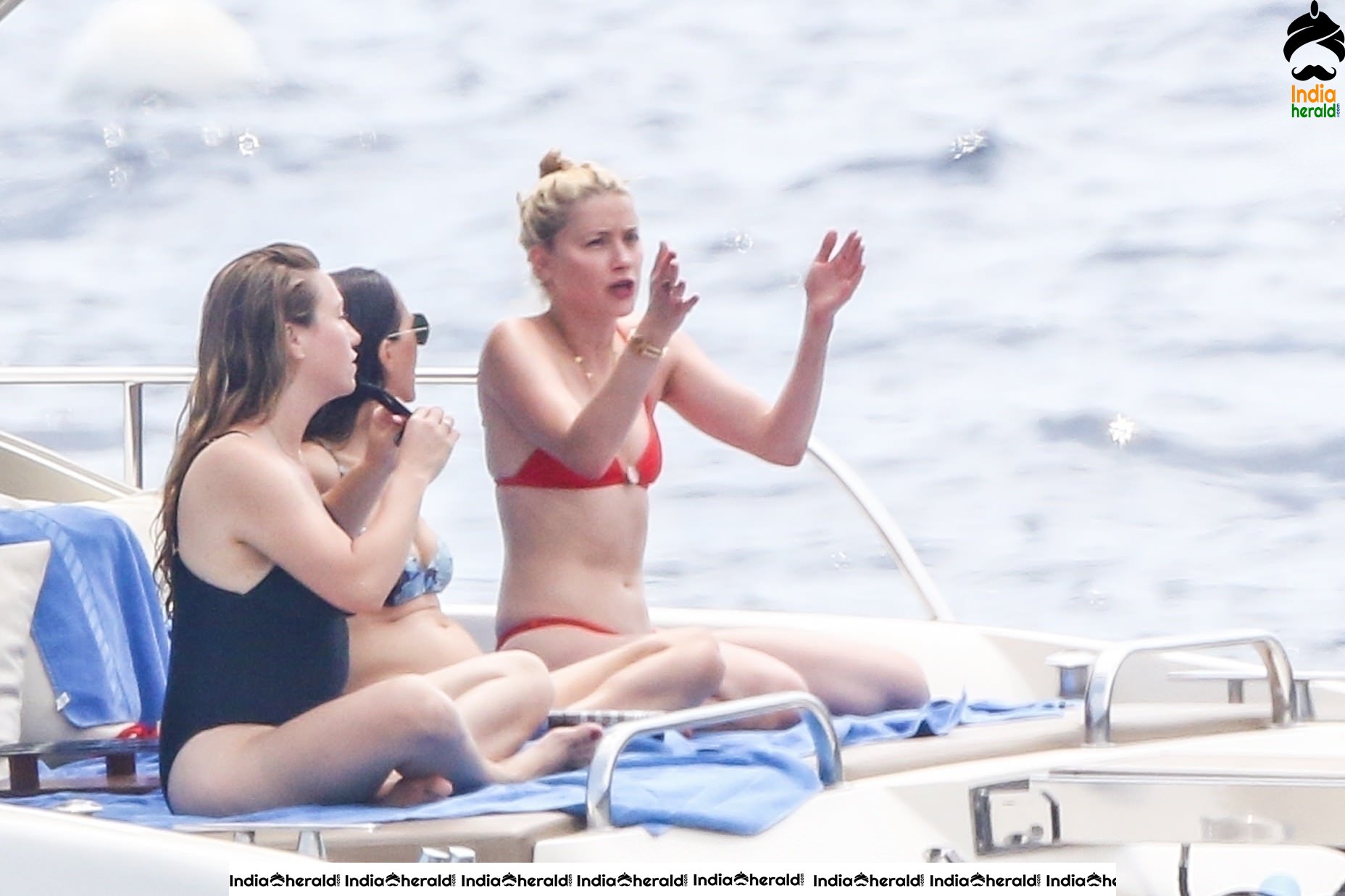 Amber Heard in Two Piece Bikini and enjoys a day with friends on a yacht at the Amalfi Coast