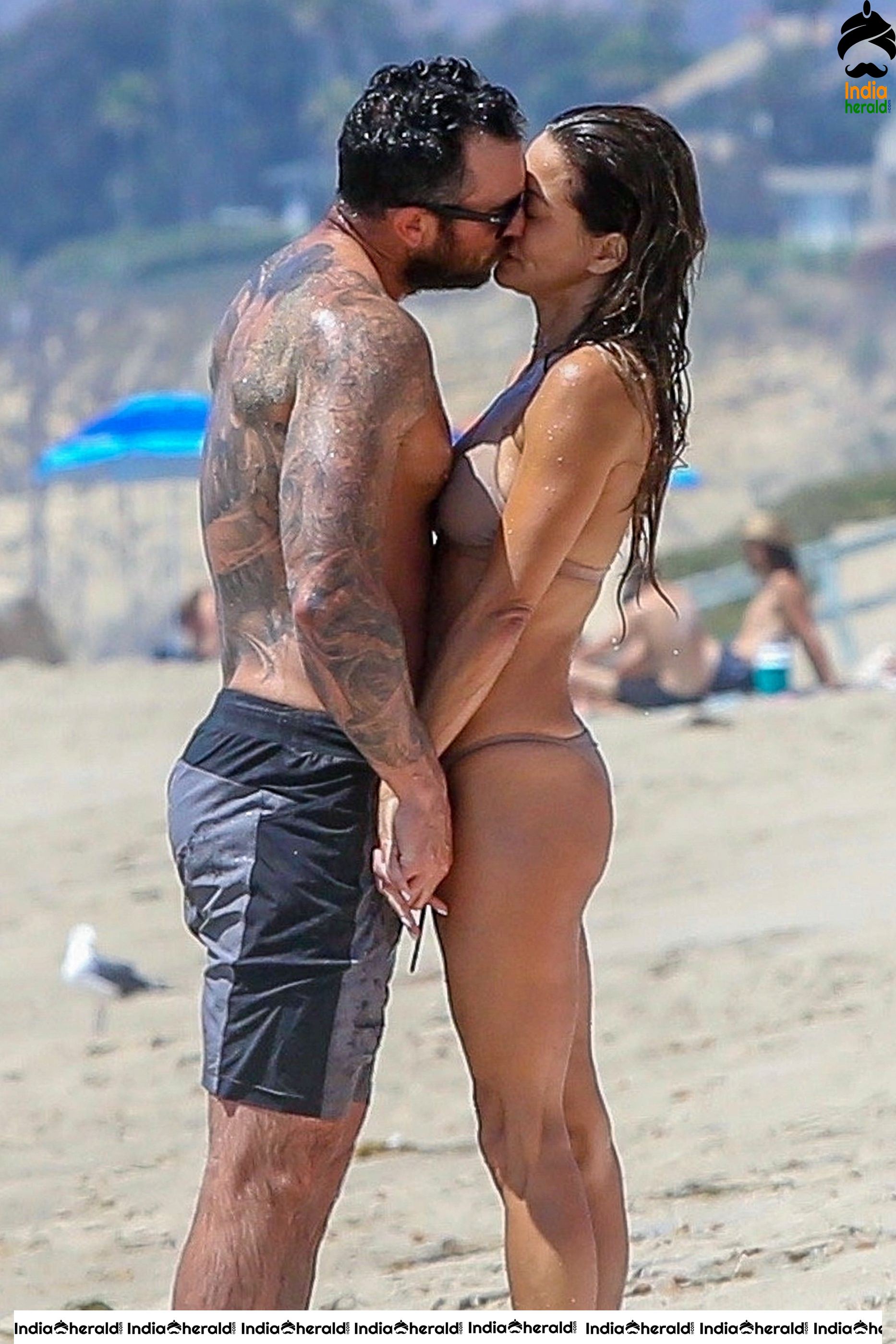 Brooke Burke in Bikini enjoying with Boyfriend on the beach in Malibu Set 1