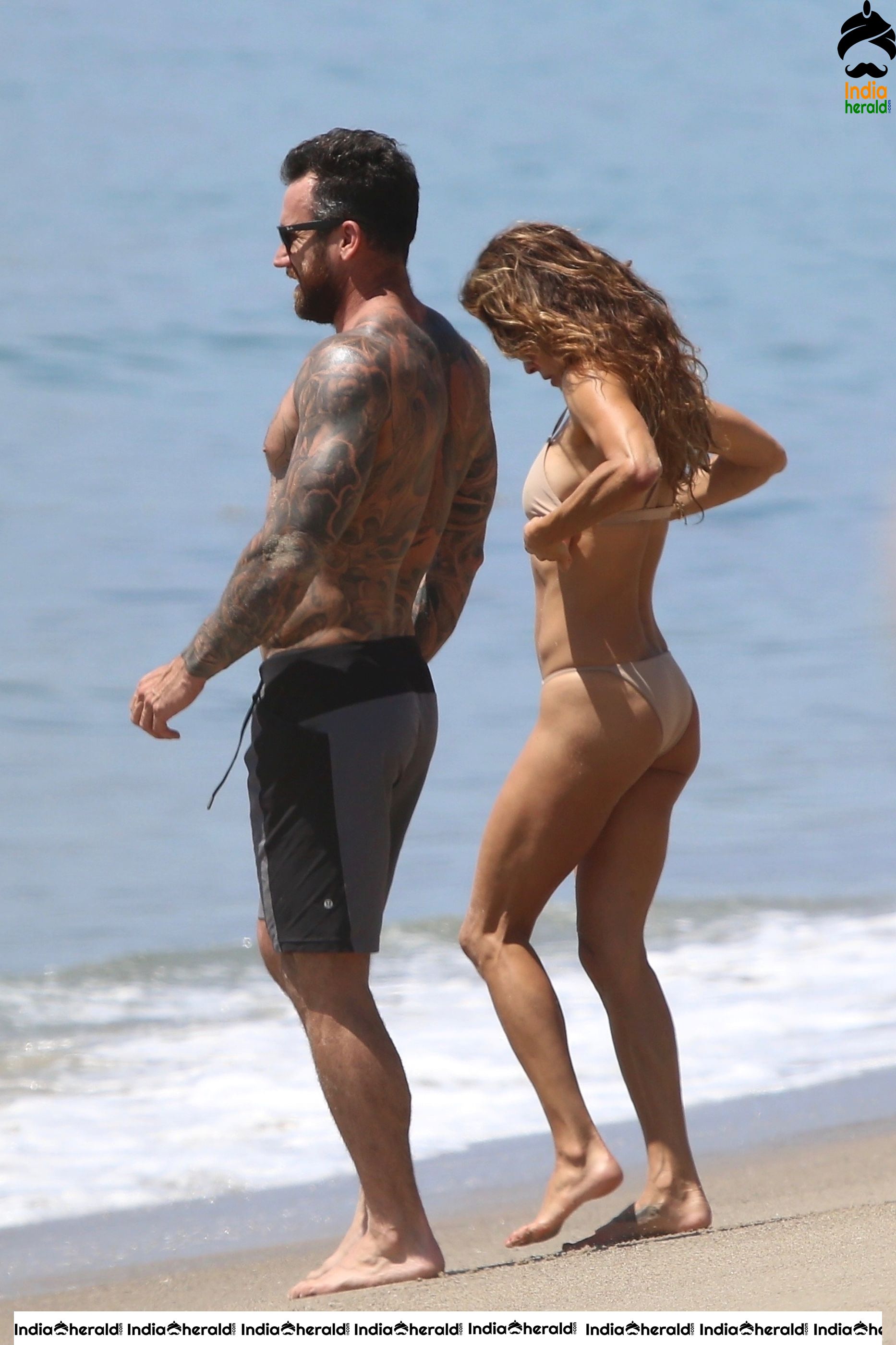 Brooke Burke in Bikini enjoying with Boyfriend on the beach in Malibu Set 1