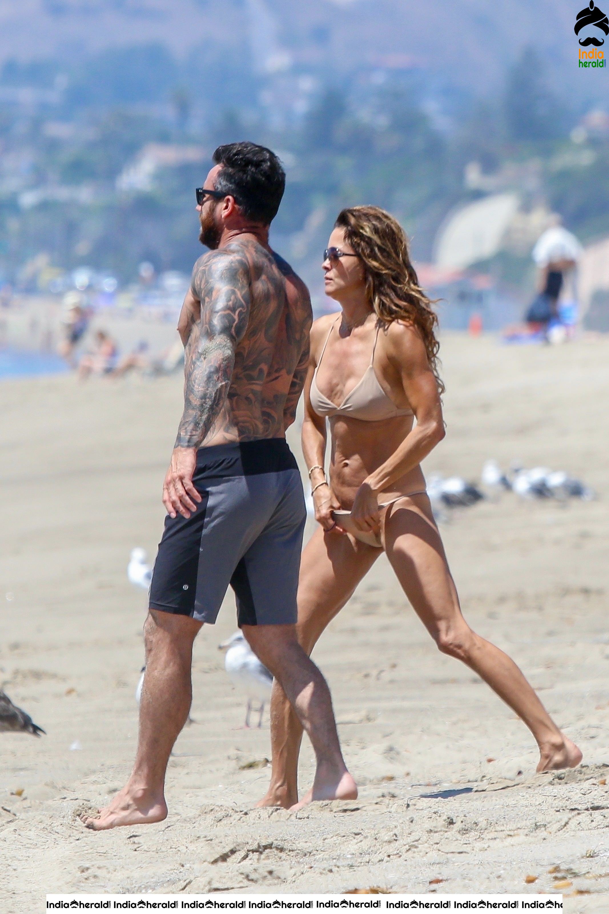 Brooke Burke in Bikini enjoying with Boyfriend on the beach in Malibu Set 1