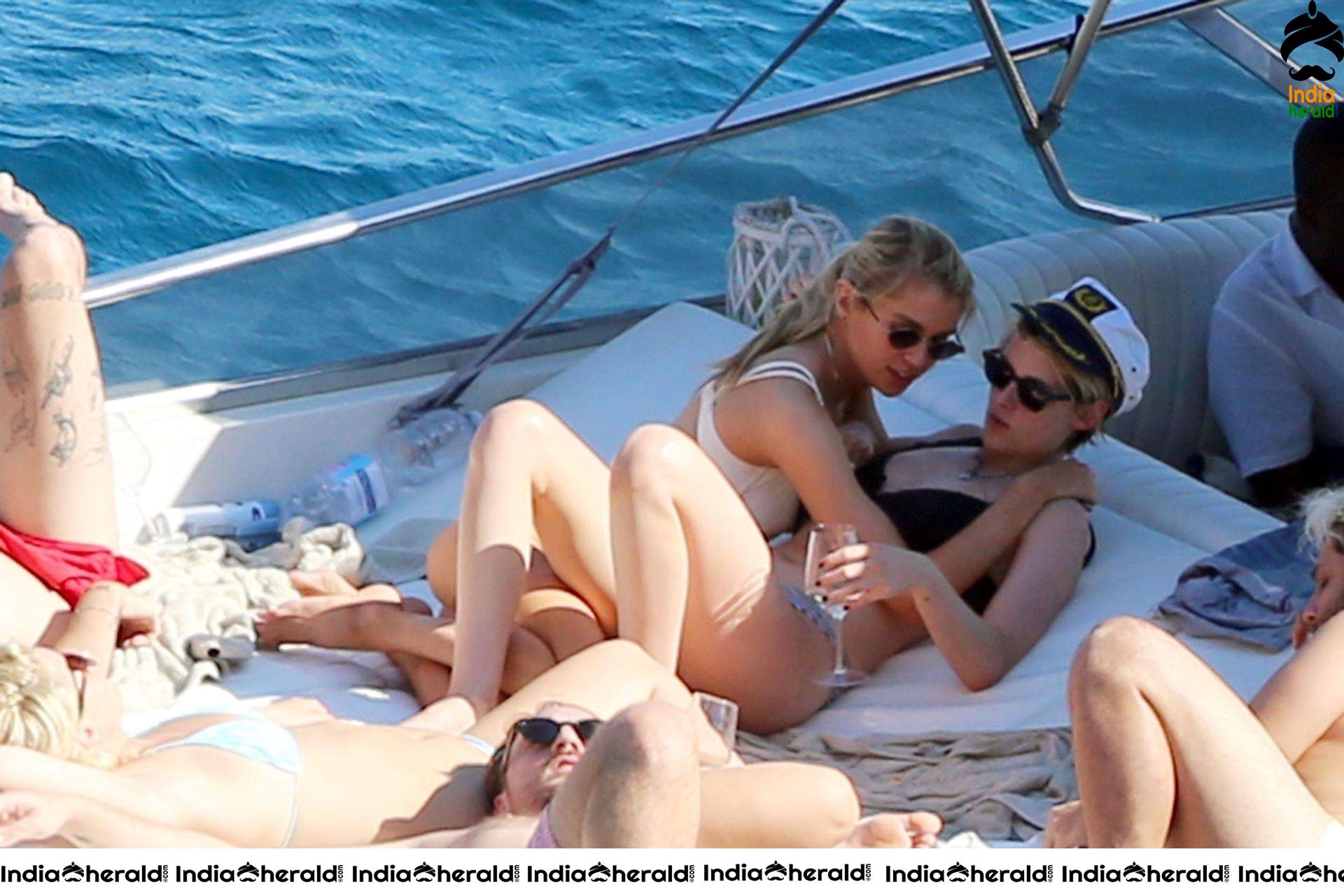 Kristen Stewart and Stella Maxwell Kissing and Cuddling each other in Bikinis at a Boat in Italy Set 2