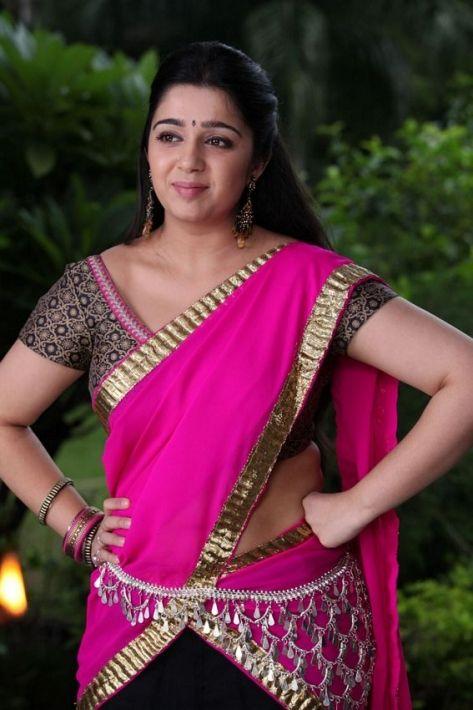 Cute And Beautiful Saree Stills Of Heroine Charmi Kaur