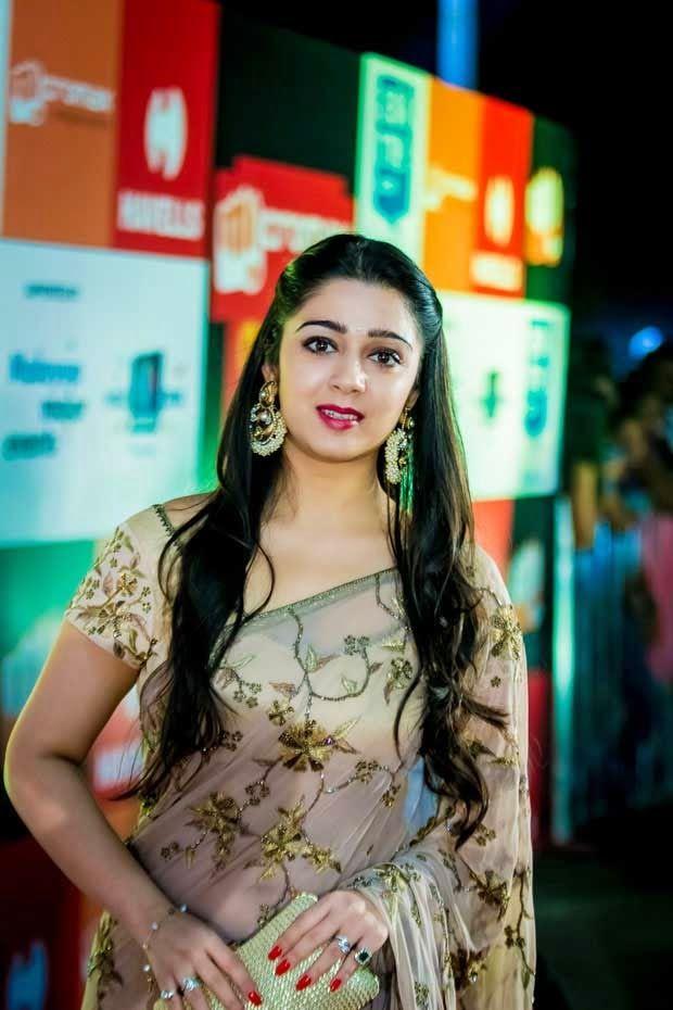 Cute And Beautiful Saree Stills Of Heroine Charmi Kaur