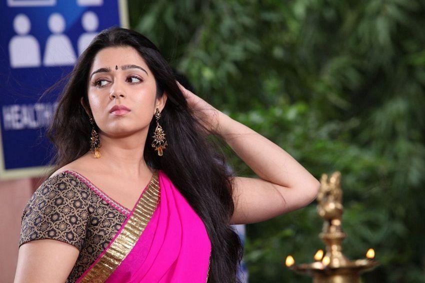 Cute And Beautiful Saree Stills Of Heroine Charmi Kaur