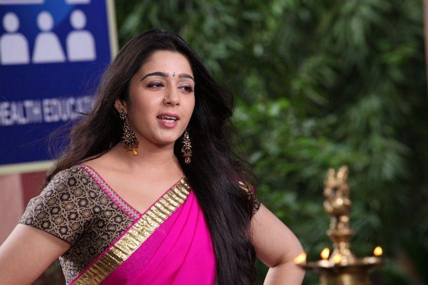 Cute And Beautiful Saree Stills Of Heroine Charmi Kaur