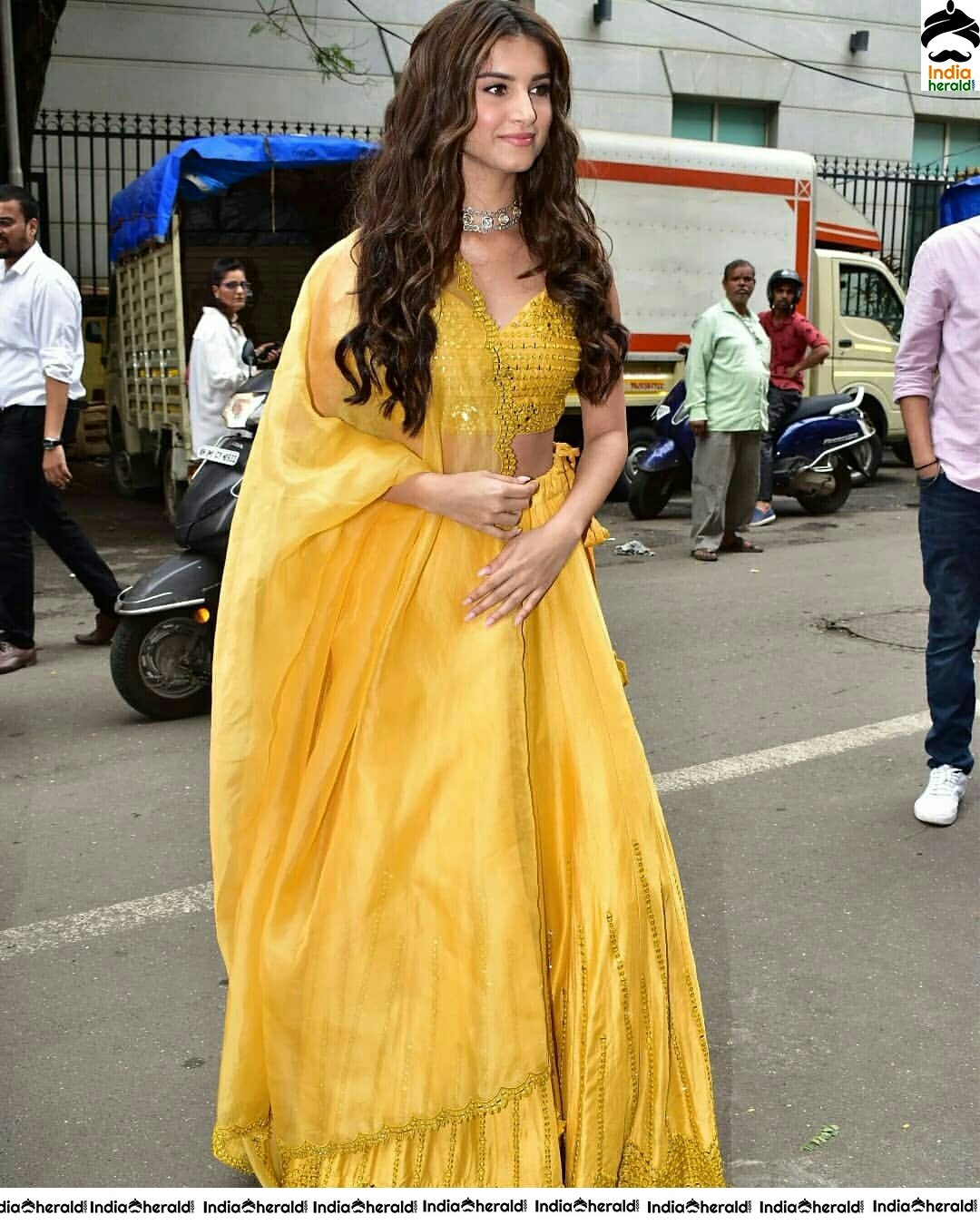 Tara Sutaria Sizzling In Yellow Waistline Revealing Dress