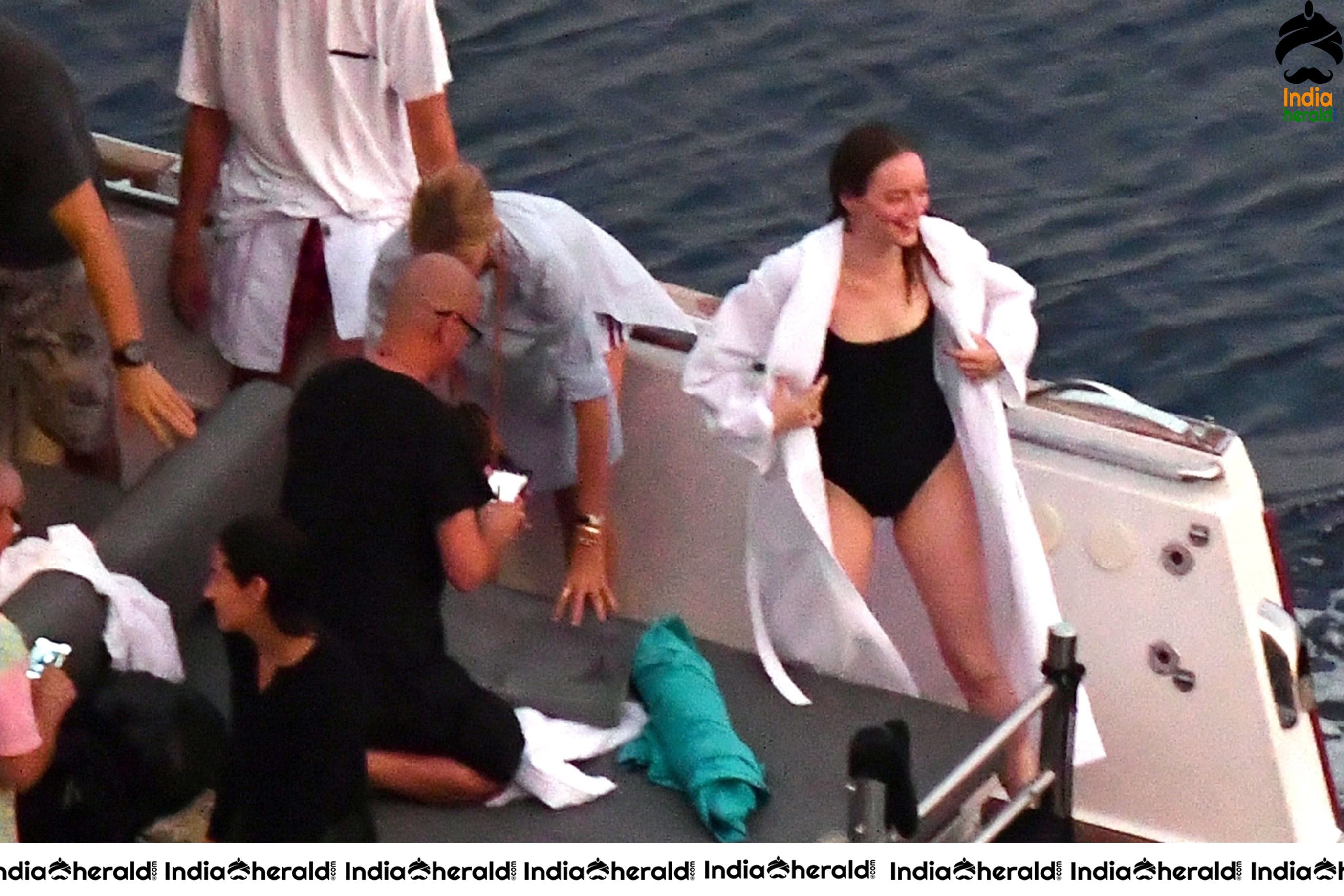 Emma Stone in Single Piece Bikini shooting an advertisement