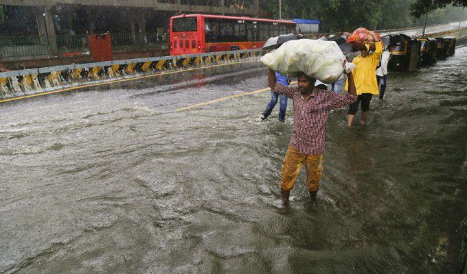 PHOTOS: Visuals of heavy rain & waterlogged streets from Mumbai's