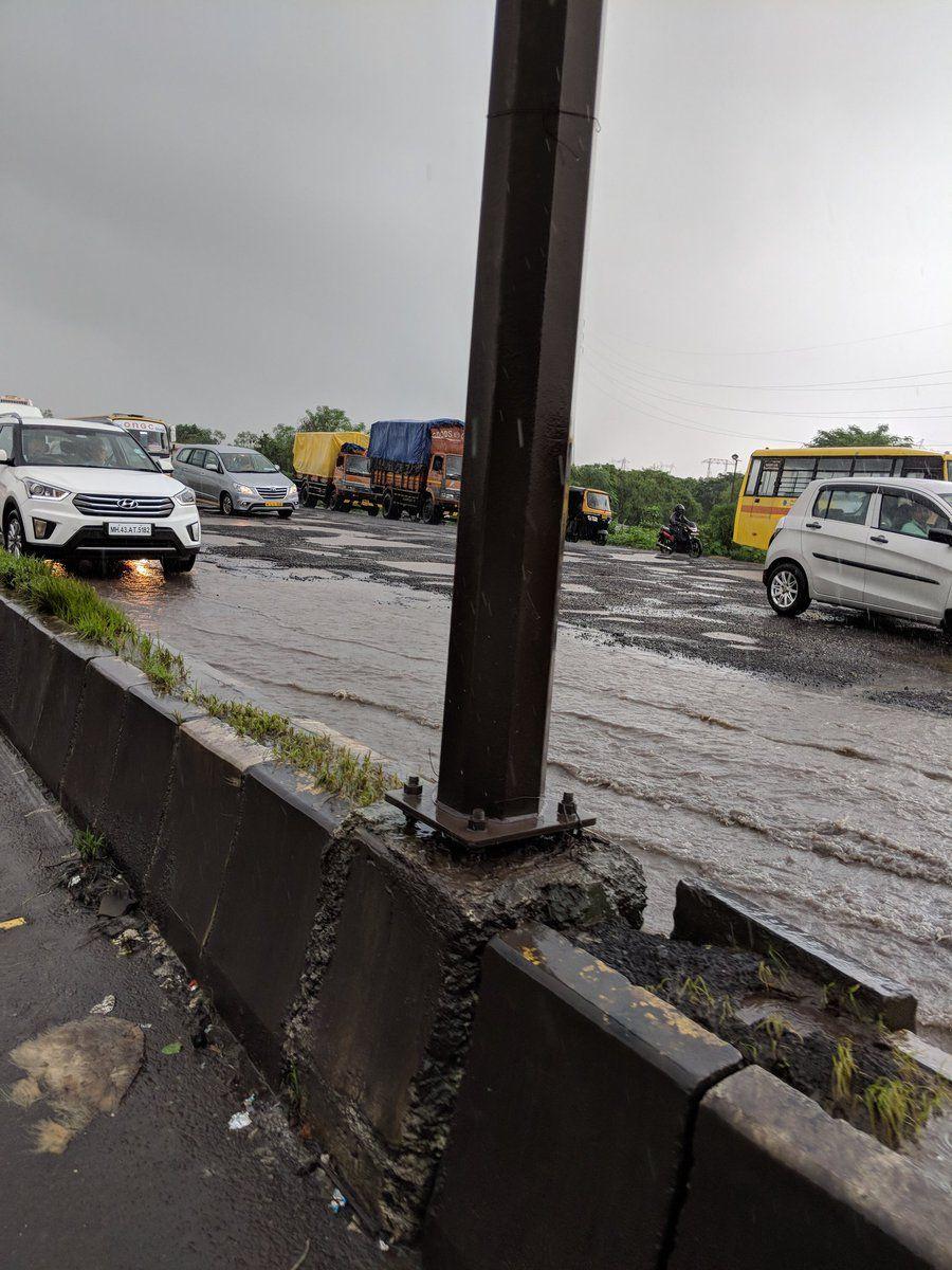 PHOTOS: Visuals of heavy rain & waterlogged streets from Mumbai's