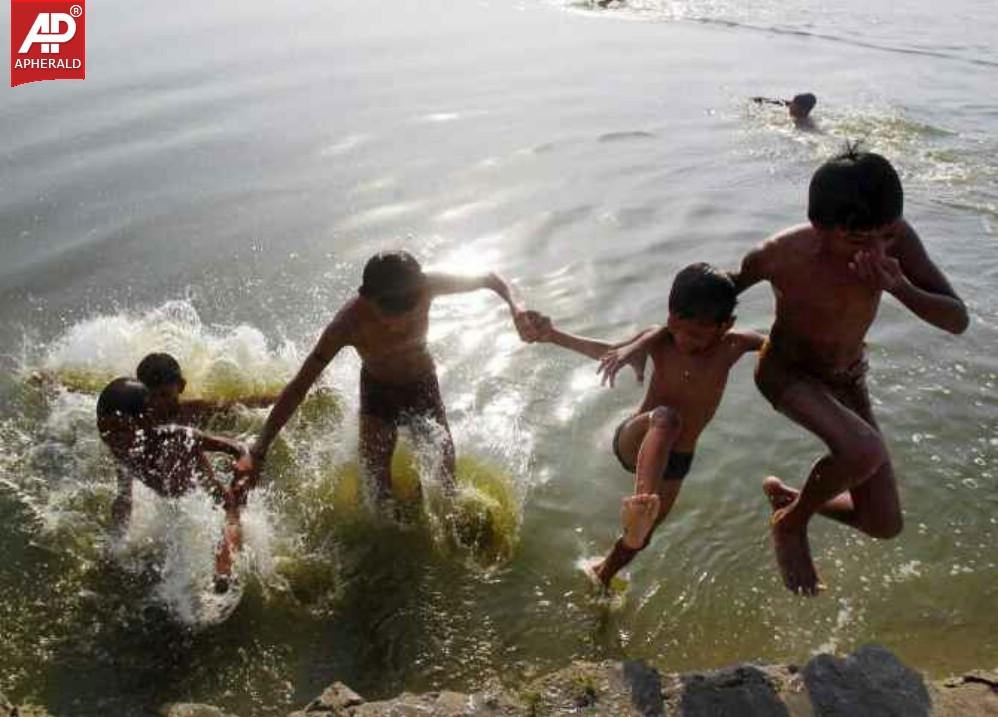 The children are swimming in the river