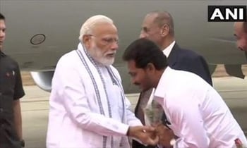 Jagan Tries Twice to Touch Modi s Feet